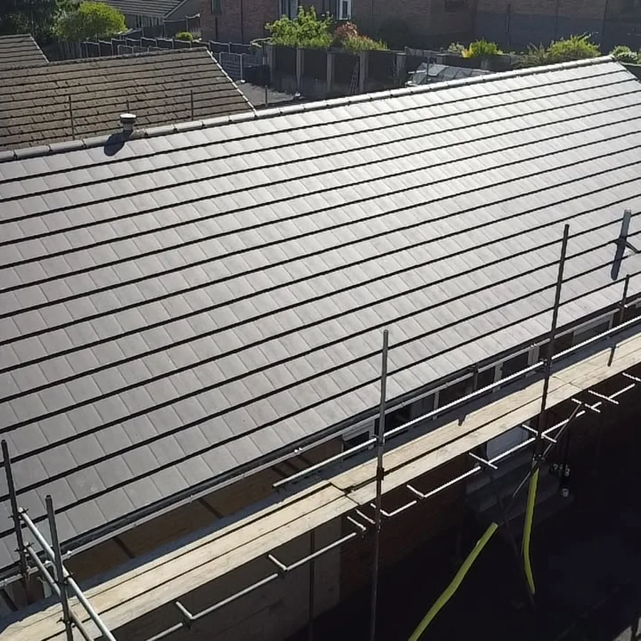 New grey tiled roof on a bungalow, scaffold still up
