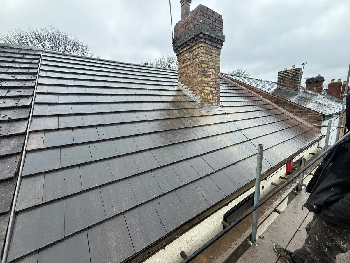 New tiled roof on a terrace, leadwork round the chimney