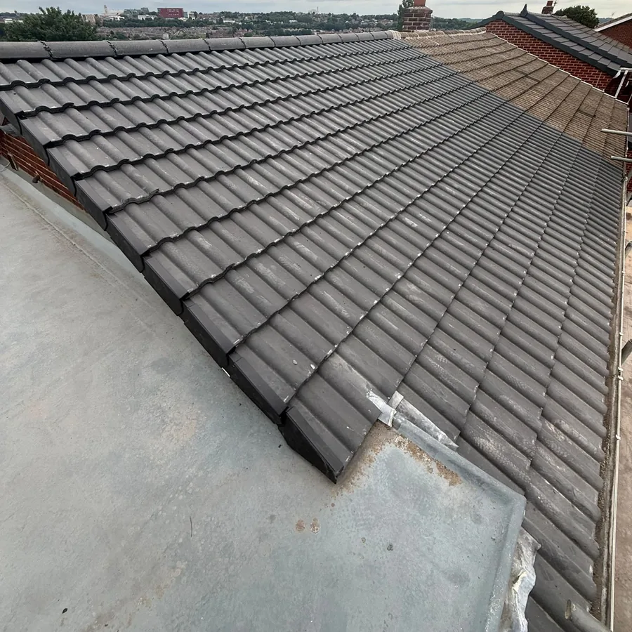 New tiles finished down to a flat roof